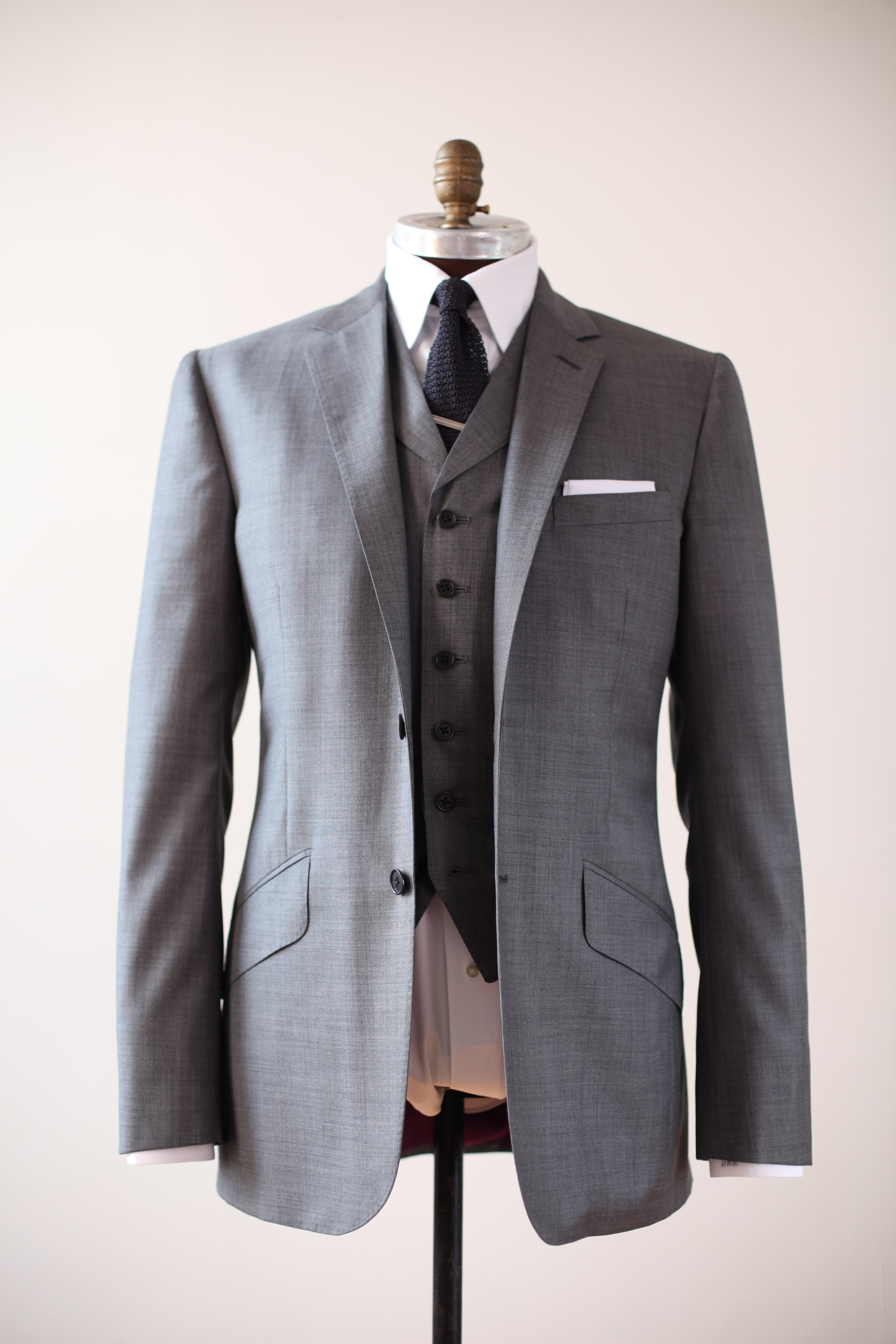 a reeves bespoke suit starts at $4000 with a 50% deposit to start and COMHXNT