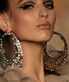 big earrings. love the winged eyeliner and those gorgeous earrings. XXOQTPD