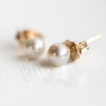white pearl stud earrings in 14k gold by melanie casey ... PYFIDFY