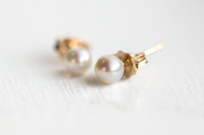 white pearl stud earrings in 14k gold by melanie casey ... PYFIDFY