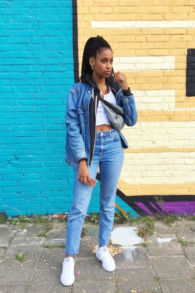 blue denim jacket with white cropped tank top and high-rise jeans