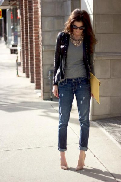 Short leather jacket with a gray scoop neck t-shirt and cuffed jeans