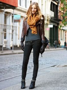 dark brown short leather jacket with gray knit sweater