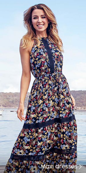 Black floral print Hawaiian style maxi dress with a flared silhouette
