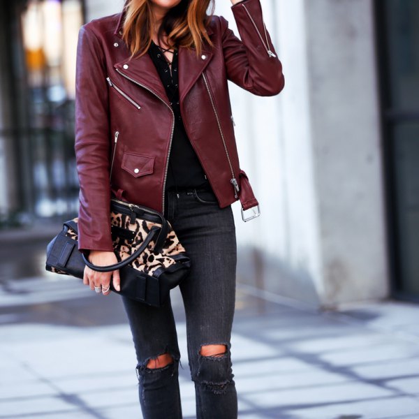 Pair a maroon leather jacket with black ripped skinny jeans