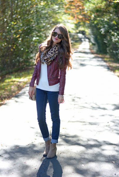 Maroon leather jacket with leopard print scarf and cuffed skinny jeans