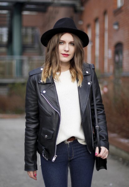 black felt hat with leather motorcycle jacket and white chunky knit sweater