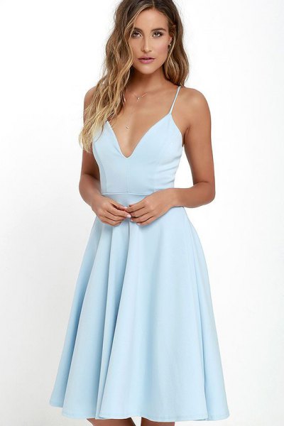 Light blue flared dress with a deep V-neckline