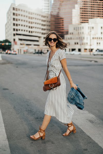 Gray and white flared midi dress with a gathered waist and red heels