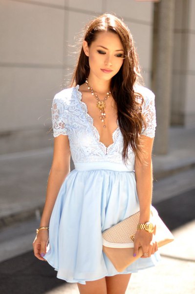 White short sleeve two tone lace mini dress with a deep V neckline and scalloped edges