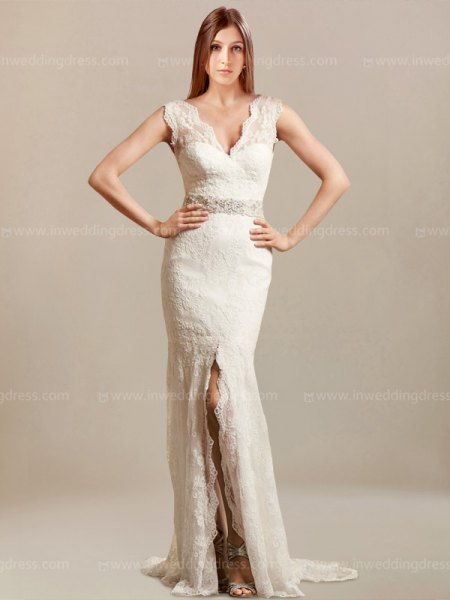 White, figure-hugging, floor-length, flowy dress with a scalloped neckline and a high slit