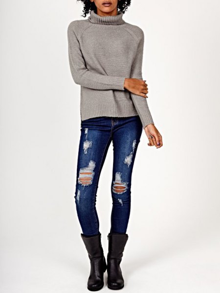 gray knit sweater with ripped skinny jeans