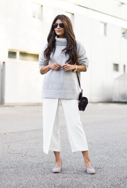 Chunky gray knit turtleneck sweater and white cropped wide-leg
pants