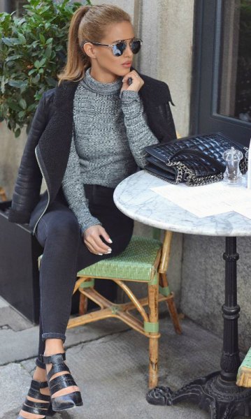 Mottled gray sweater with a black leather jacket and skinny
jeans