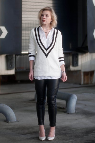 White and black V-neck sweater, button-up shirt and leather
leggings