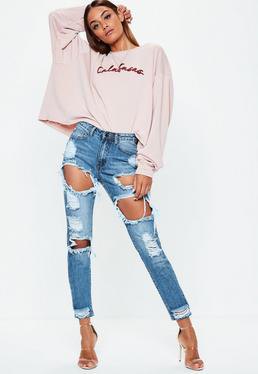Light pink long sleeve graphic tee with distressed mom jeans