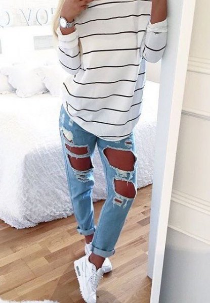 White and black striped long sleeve t-shirt with super ripped light blue jeans