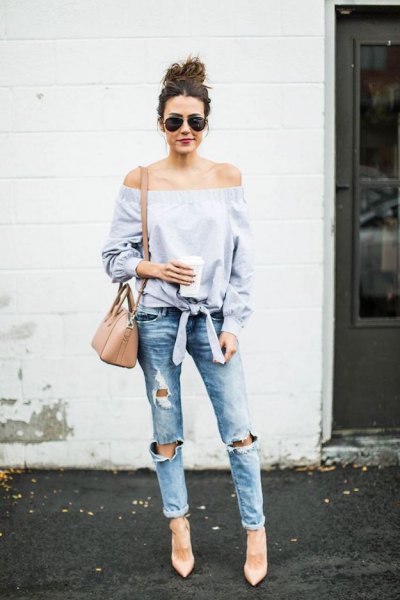 Light blue off the shoulder knotted blouse with ripped boyfriend jeans