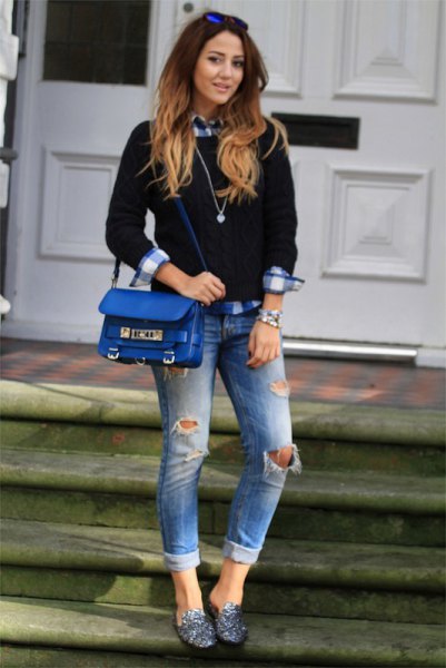 Black knit sweater with plaid boyfriend shirt and ripped cuffed jeans