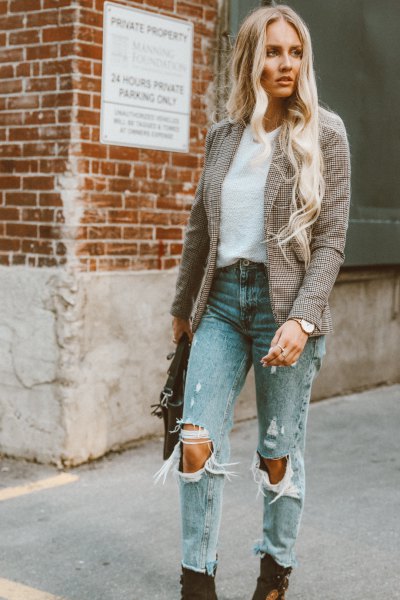 Tweed blazer with ripped mom jeans and black boots