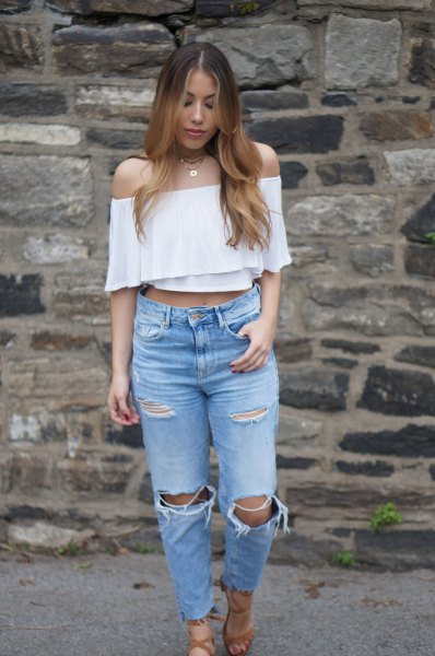 White off the shoulder blouse with ripped knee jeans