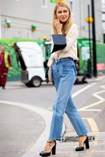 White sweater with blue high waist mom jeans