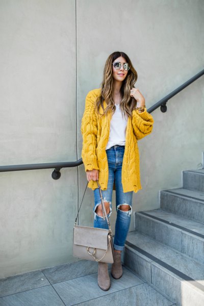 Lemon yellow cable knit cardigan with blue destroyed jeans