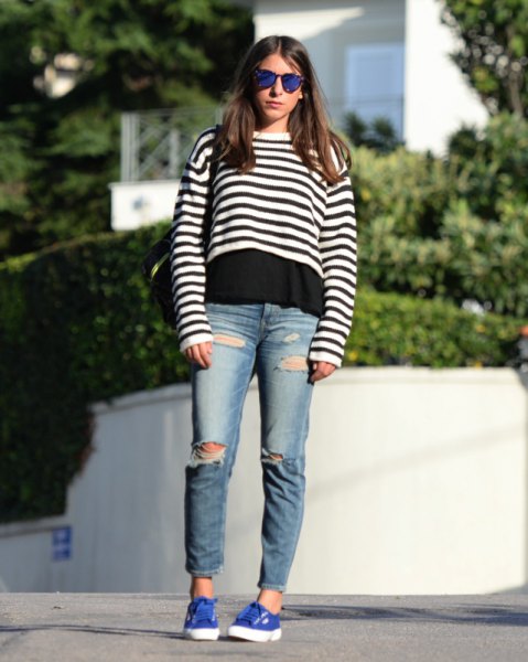 Black and white striped cropped sweater worn over t-shirt and boyfriend jeans