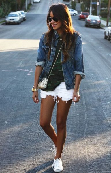 Blue denim jacket with camouflage t-shirt and ripped white denim shorts