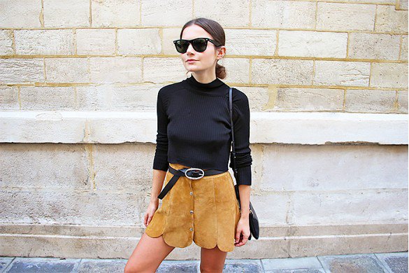 Black sweater with scalloped hem and suede mini skirt