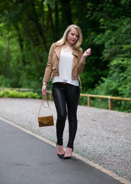 brown leather jacket with white scoop neck t-shirt and black
leggings