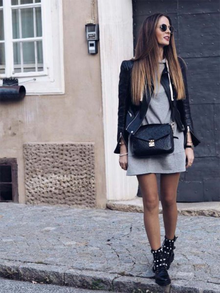 Black leather jacket with gray mini hoodie dress and studded boots