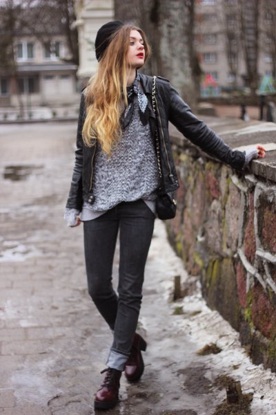 gray sweater with black leather jacket and cuffed jeans