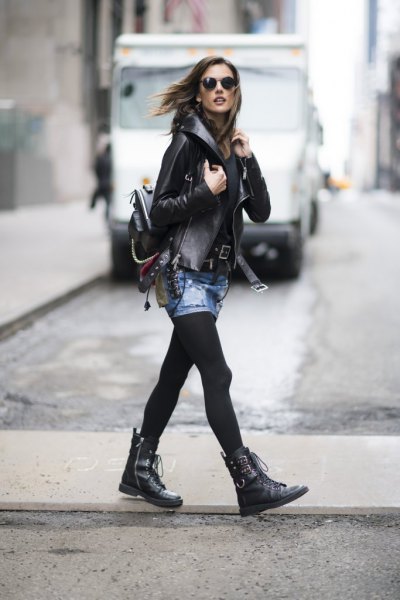 Leather jacket with mini denim skirt and black leather boots with studs