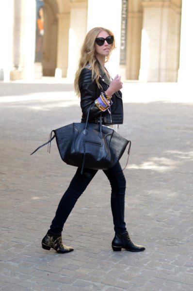 Biker jacket with skinny jeans and black leather ankle boots with studs