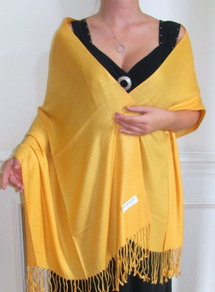 Lemon yellow fringed scarf with black deep V-neck midi dress