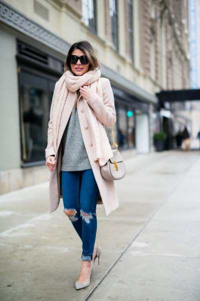 White long wool coat with blue ripped skinny jeans with cuffs