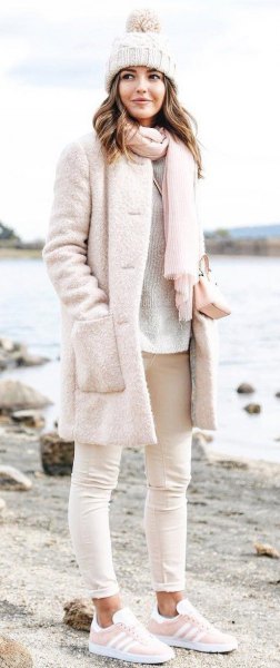 Super light pink fluffy coat with matching knitted scarf and
knitted hat