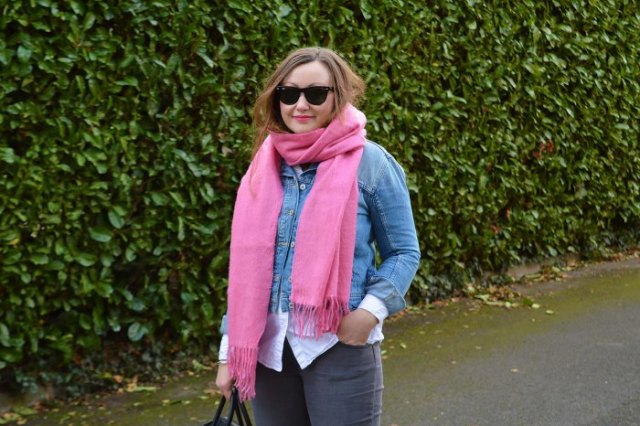 blue denim jacket with white button down shirt and flashy pink
scarf