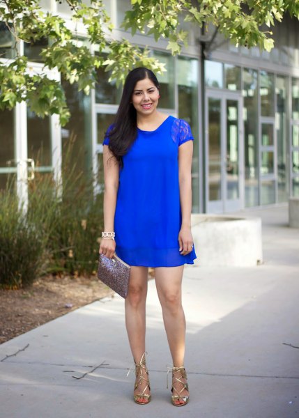 Royal blue lace mini shift dress with cap sleeves and metallic strappy heels