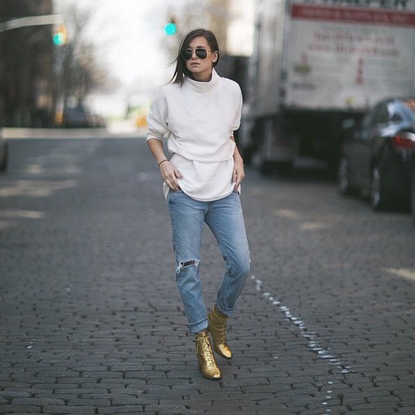 White turtleneck with light blue boyfriend jeans and gold combat
boots