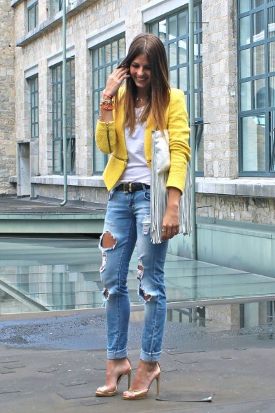 yellow blazer with blue ripped boyfriend jeans and gold dress shoes