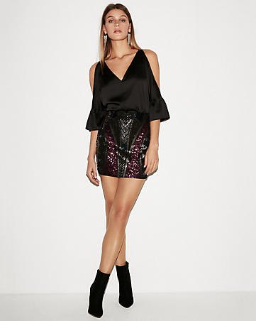 V-neck off-the-shoulder chiffon blouse with black high-rise sequin mini skirt