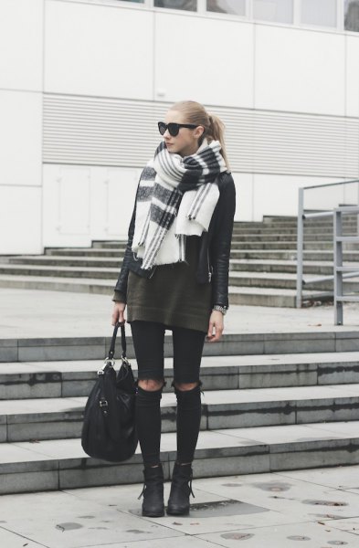 gray tunic sweater with black ripped skinny jeans and white scarf