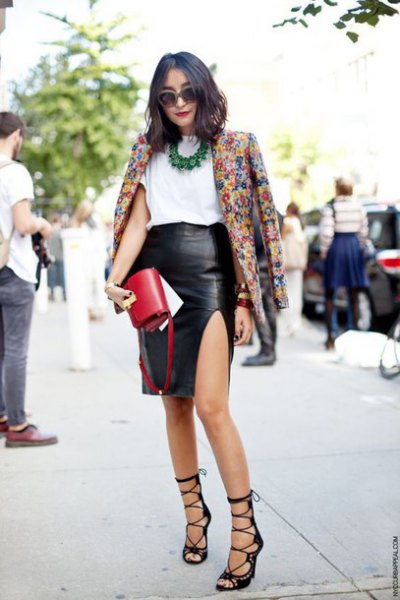 Floral print blazer and black faux leather skirt with side slits