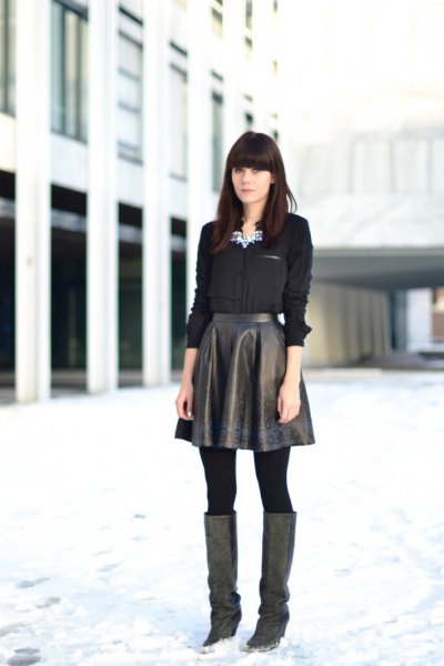Black button down shirt with high waist flared leather skirt