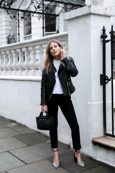 Black motorcycle jacket with ankle-length skinny jeans and checkered heels