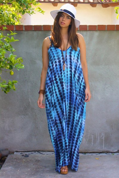 Blue and white sleeveless tie-dye maxi dress and floppy hat