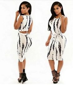 Black and white bodycon midi dress with open back and strappy
heels