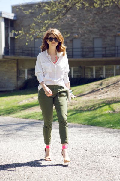 White button down blouse and army green ankle pants